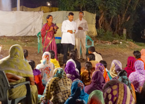 Marriamma shares her testimony with a group of women at the gospel meeting.