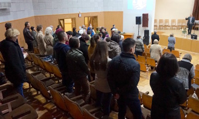 People stand to accept Christ at Venue 2