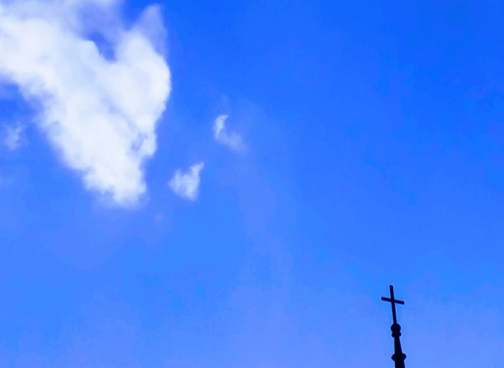 Understanding Jesus - photo for article with heart shaped cloud and cross by Laura Burns